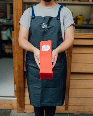 Staff holding 10 year Totara Tasty log 1.9kg 